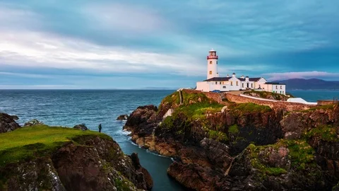 Fanad head lighthouse at Donegal, Ireland. Time-lapse at sunset Stock Footage