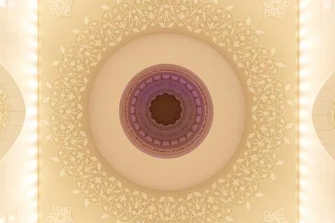 Fanciful arabic patterns on the ceiling of a mosque Stock Photos