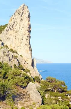 Fanciful rocks on coastline Stock Photos
