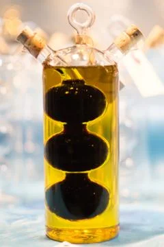 Fancy and chick bottle with olive oil and vinegar Stock Photos