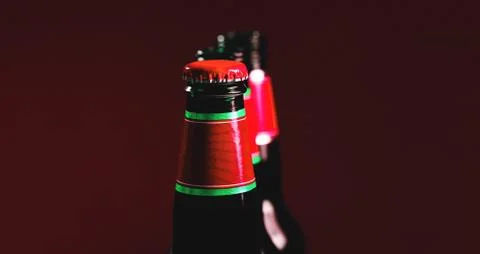 Fancy brown bottle of soft drink. Beer bottles with red cap. Stock Photos