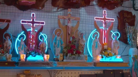 Fancy catholic religious souvenirs with the Virgin Mary and crucifixion Stock Footage 330899174