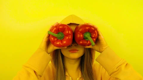 Fancy caucasian model with fresh vegetables on eyes. Stop motion looped. Stock Footage 102274879