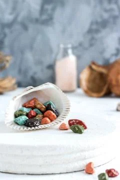 Fancy chocolates in the shape of sea pebbles. Stock Photos