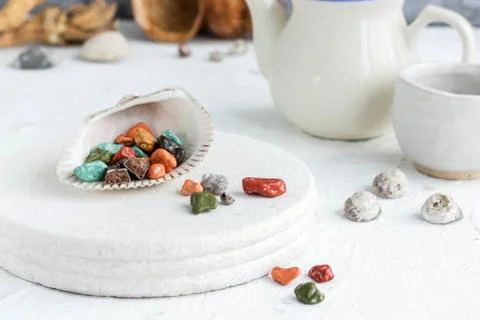 Fancy chocolates in the shape of sea pebbles. Stock Photos