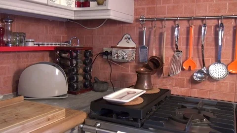 Fancy clean kitchen with utensils and stove Stock Footage 79593454