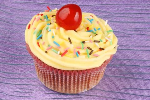 Fancy cupcake with candied cherry Stock Photos