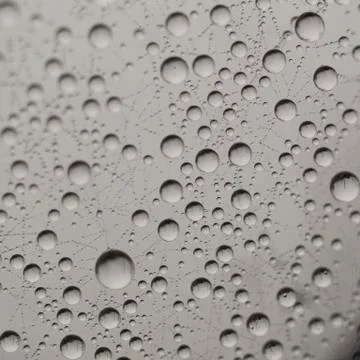 Fancy drops on glass Stock Photos
