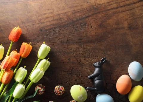 Fancy easter eggs with tulips flower for Easter festival backgrounds Stock Photos