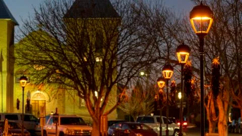 Fancy Light Posts Emitting Orange Light with Hanging Chile Ristras in Small Stock Photos