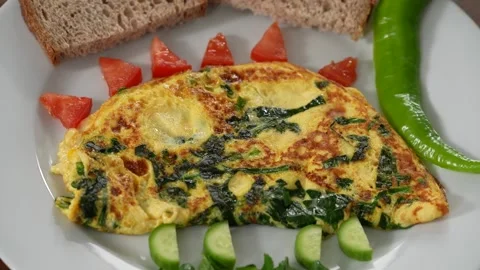 Fancy omelet close-up camera pan Stock Footage 183558394