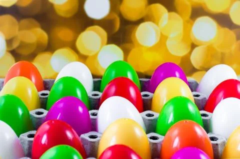 Fancy or colorful of egg in spawn box with yellow bokeh light background. sof Stock Photos