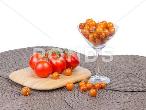 Fancy orange cherry tomatoes and red tomatoes on vine. Stock Photos