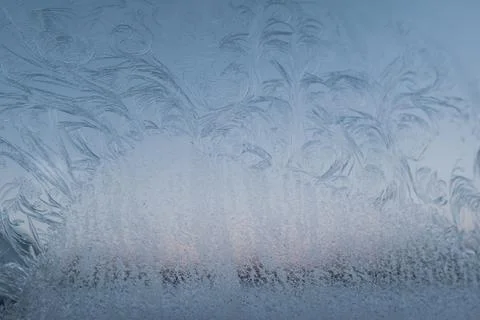 Fancy patterns drawn on a frosty winter day. Frost texture Stock Photos