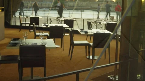 Fancy restaurant tables with wine glasses ready for customers to walk inside Stock Footage 287302773