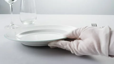 Fancy restaurant, waiter Elegant table setting with white square plate and Video stock 280315884