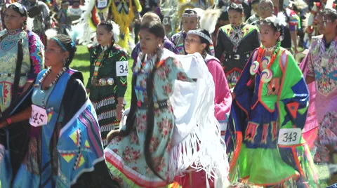 Fancy shawl dancers arrive during pow wow grand entry Video stock 46562441