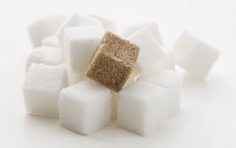 Fancy sugar stack of white sugar cube with one brown cube Copyright: xZoon... Stock Photos