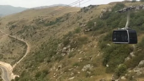 Fanicooler climbs the mountain Stock Footage 156034014
