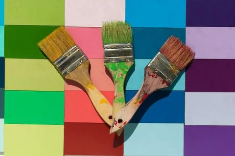 Fanned out paint brushes on a spring colored backdrop Stock Photos