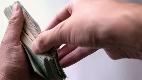 Fanning Through Large Stack Of Twenty Dollar Bills Several Times Stock Footage 247418456