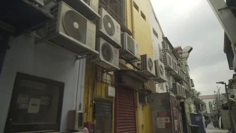 Fans and air conditioners on the outside of a building in singapore. Stock Footage