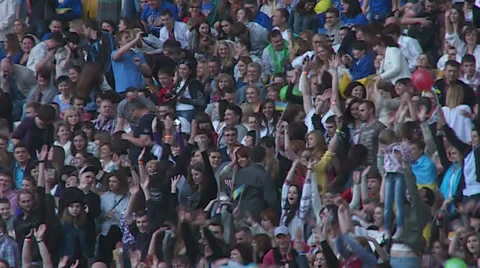 Fans are doing the wave front of a rock concert at the stadium in Kiev. Stock Footage 39710667