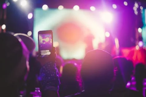 Fans are having fun, both taking pictures with the camera and mobile phone. C Stock Photos