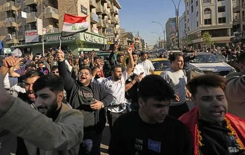 Fans in Baghdad react to their team qualifying for the FIFA World Cup 2026, Iraq Stock Photos
