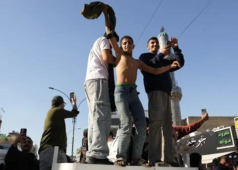 Fans in Baghdad react to their team qualifying for the FIFA World Cup 2026, Iraq Stock Photos