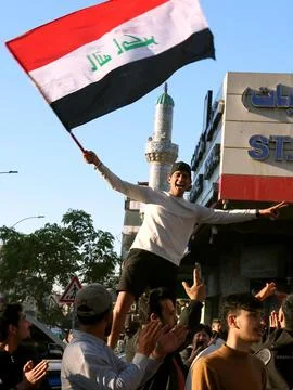 Fans in Baghdad react to their team qualifying for the FIFA World Cup 2026, Iraq Stock Photos