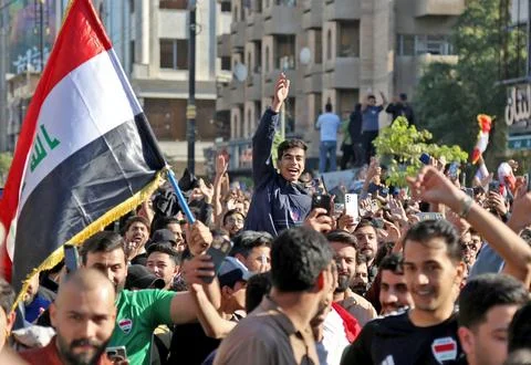 Fans in Baghdad react to their team qualifying for the FIFA World Cup 2026, Iraq Stock Photos
