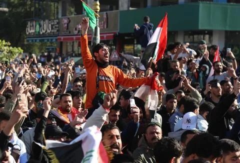 Fans in Baghdad react to their team qualifying for the FIFA World Cup 2026, Iraq Stock Photos