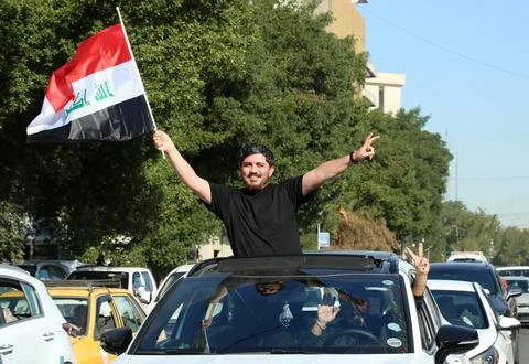 Fans in Baghdad react to their team qualifying for the FIFA World Cup 2026, Iraq Stock Photos