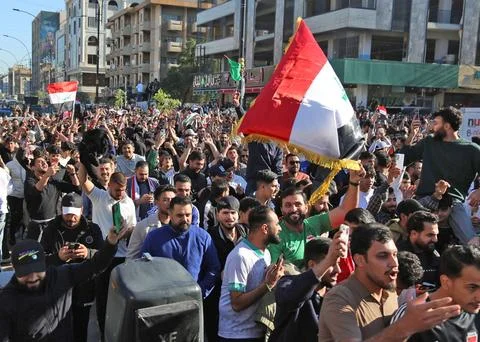 Fans in Baghdad react to their team qualifying for the FIFA World Cup 2026, Iraq Stock Photos