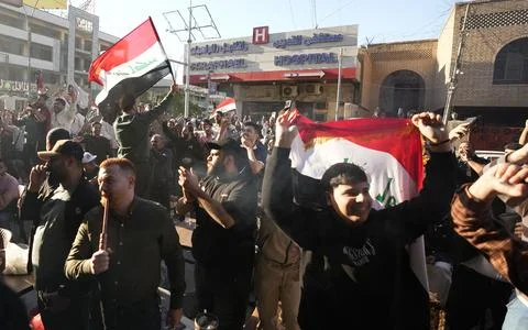 Fans in Baghdad react to their team qualifying for the FIFA World Cup 2026, Iraq Stock Photos