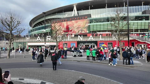 Fans begin to arrive outside the Emirates Stadium, Highbury on a WSL match day Stock Footage 305142593