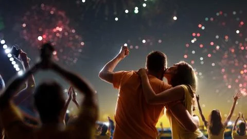 Fans celebrate in Stadium Arena night fireworks Stock Photos