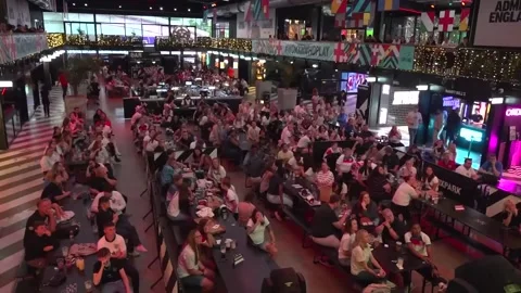 Fans cheer and scream as England women's lose to France in Euros Stock Footage 312530419