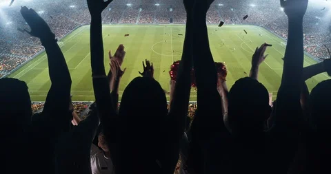 Fans clapping hands to cheer their favorite sports team on the stands of the Stock Footage 101015618