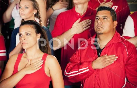 Fans: crowd stands for national anthem Stock Photos