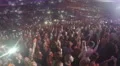 Fans enjoying popular love song at concert, waving mobile phones in air slowly 4k or 4k+ Resolution