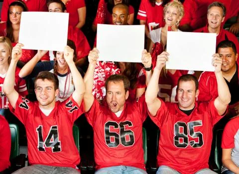 Fans: guys holding up small blank signs Stock Photos