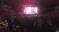 Fans jumping wildly in ecstasy, enjoying performance. Robbie Williams singing HD Footage