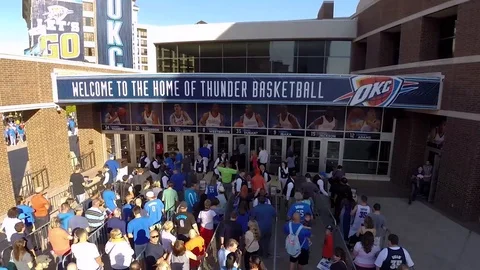 Fans Line up to watch Oklahoma City Thunder NBA Team Play Basketball in Arena Stock Footage