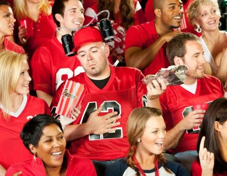 Fans: man gets sick from too much stadium food Stock Photos