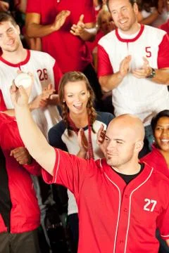 Fans: man shows off caught baseball Stock Photos