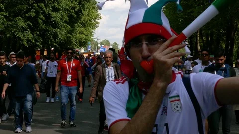Fans moving toward stadium before the start of FIFA world cup game with vuvuzela Stock Footage 91463509