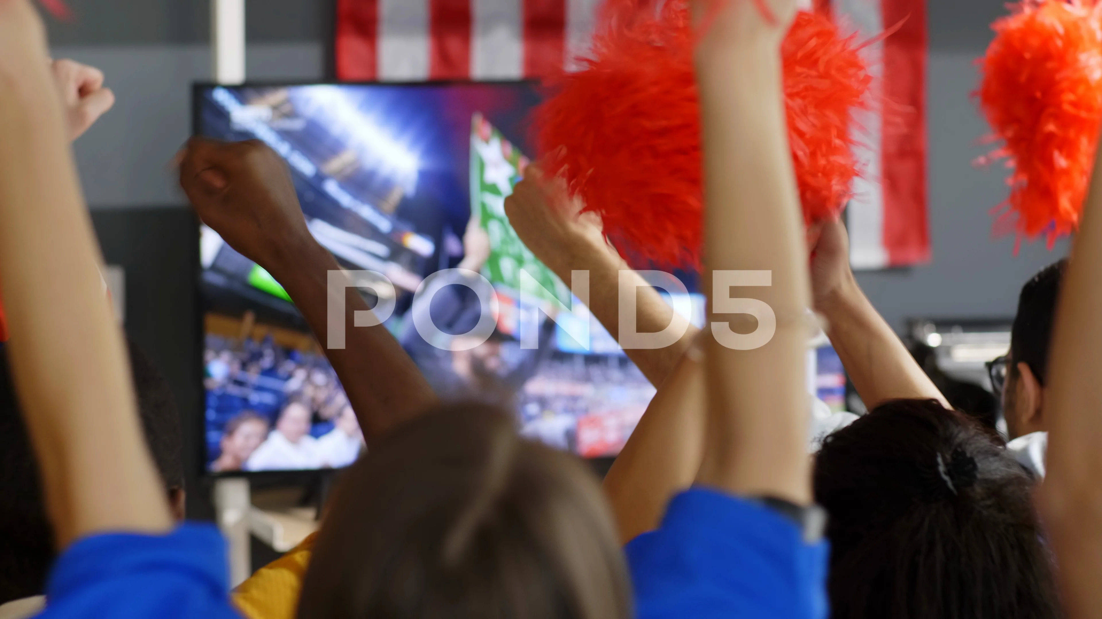 A cheerleader shakes her pom-poms smiles and encourages action