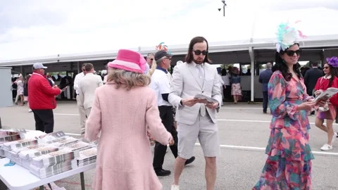 Fans Purchasing Racing Programs at the Kentucky Oaks 動画素材 336478215